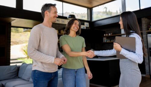what is a real estate broker in Washington - real estate agent greets clients in home