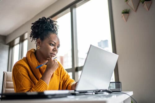 woman studies for real estate exam